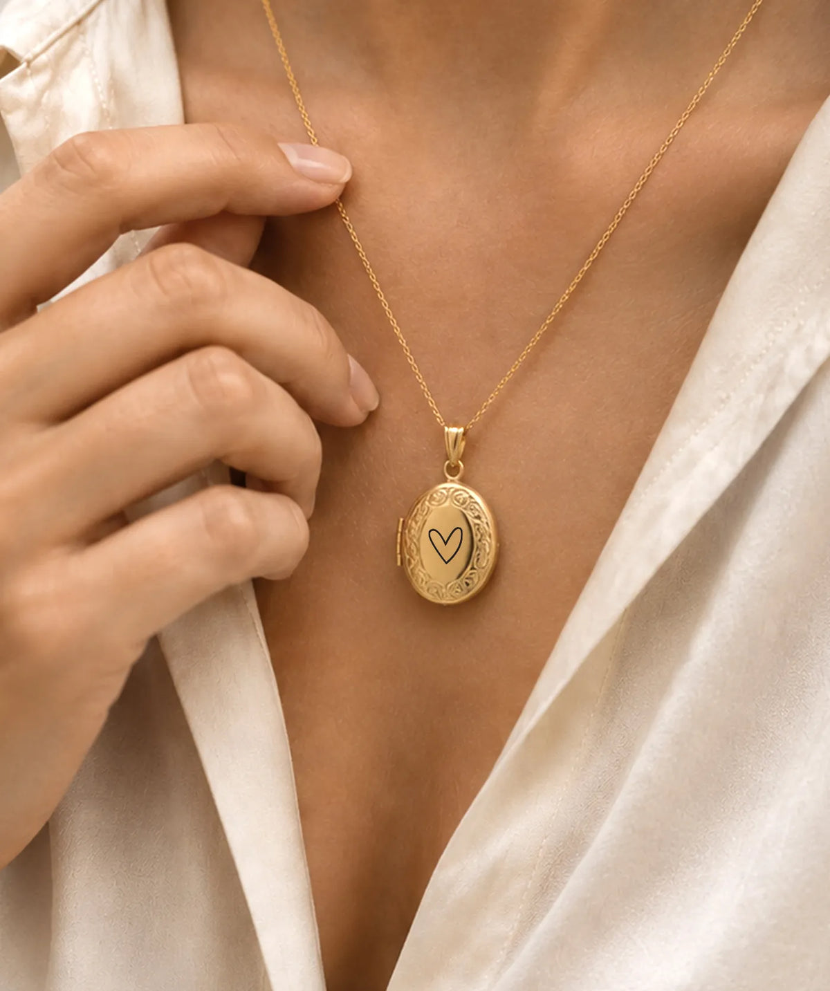 Model wearing the Gold Oval Photo Locket Necklace around the neck
