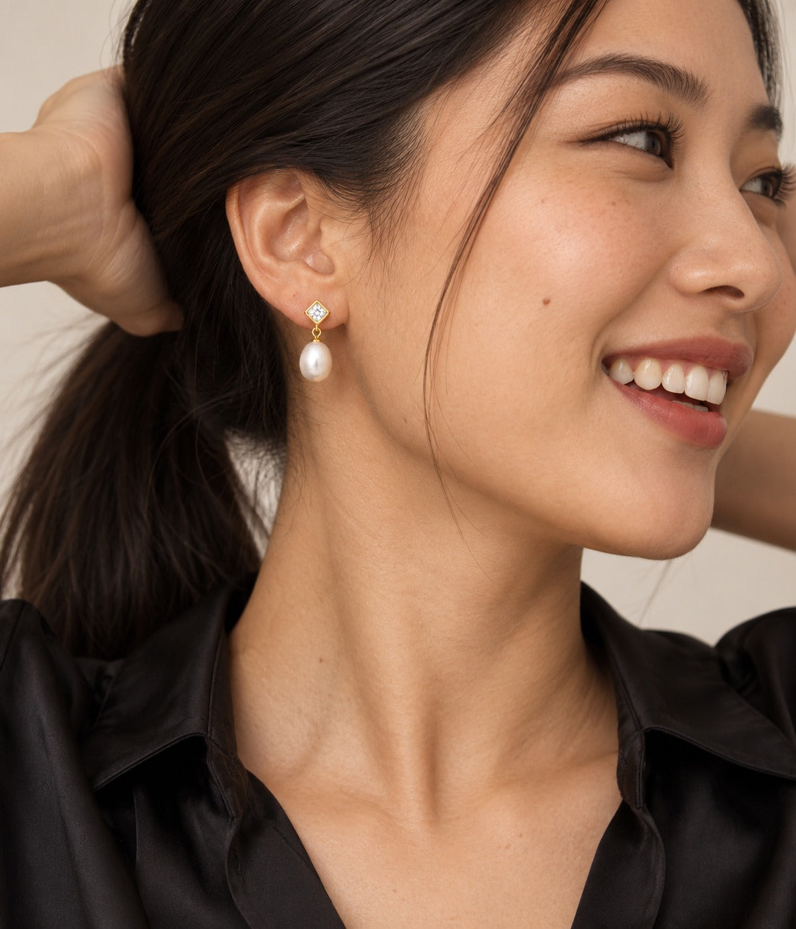 Gold Pearl Drop Stud Earrings on model