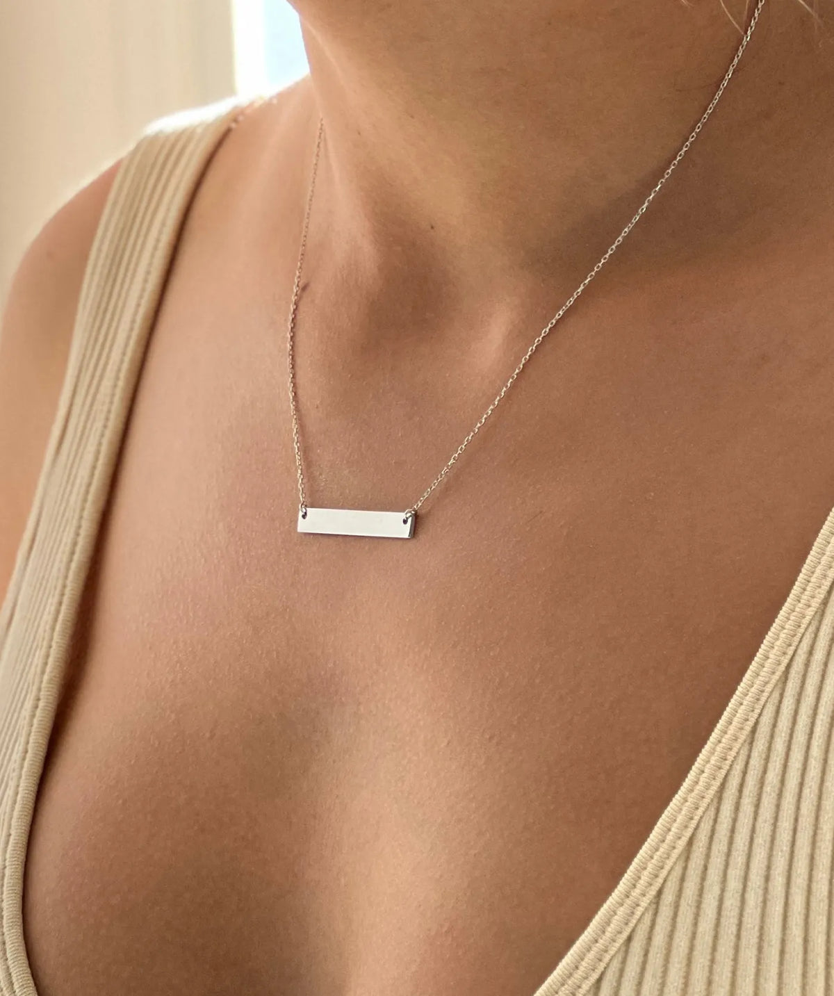 Model wearing the Silver Horizontal Tag Necklace around the neck