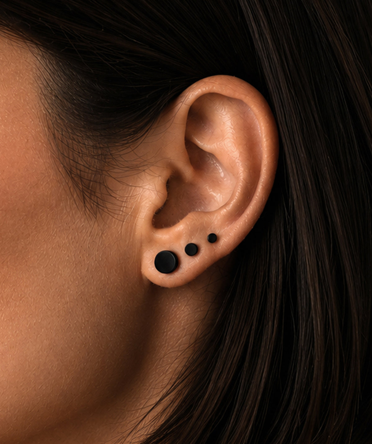 Model wearing the Black Butterfly Stud Earrings on the ear