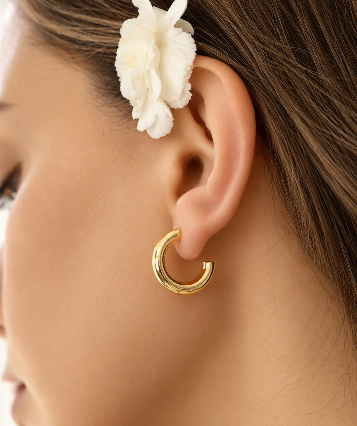 Model wearing the Gold Open Hoop Earrings on the ear