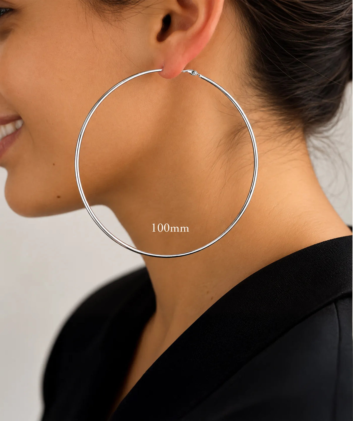 Model wearing the Silver Endless Large Hoop Earrings on the ear