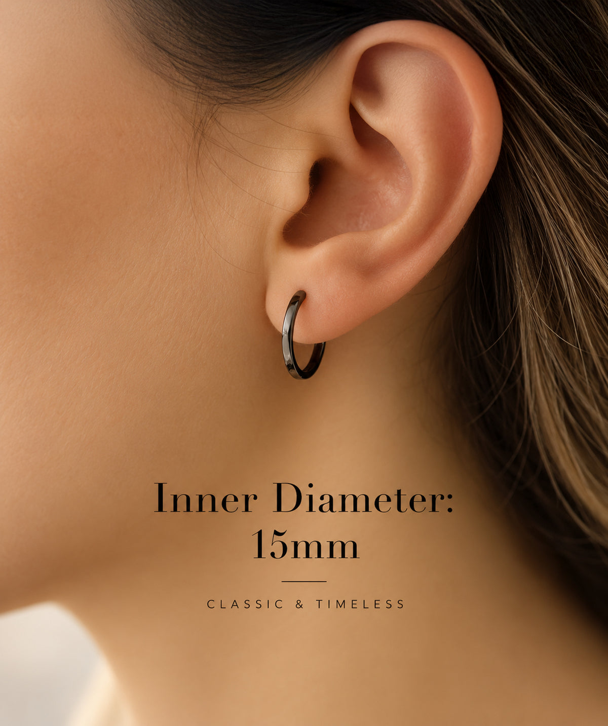 Model wearing the Black Flat Sleeper Hoop Earrings on the ear