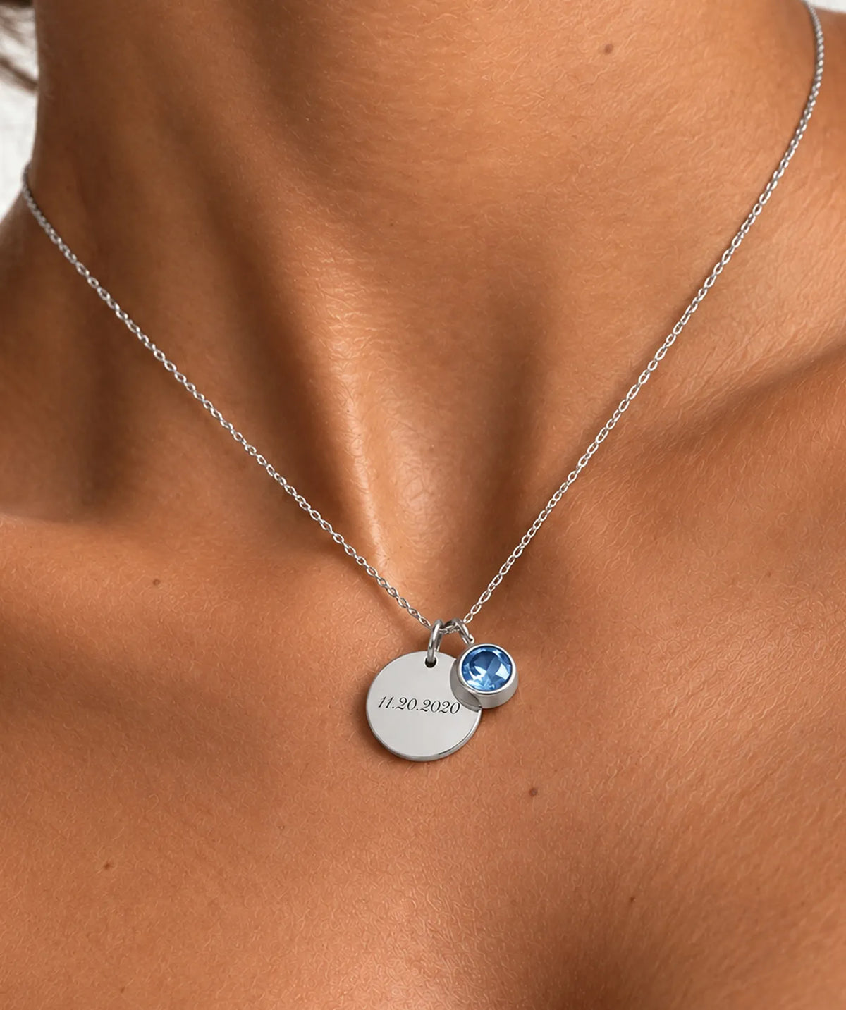 Model wearing the Silver Disc Necklace around the neck