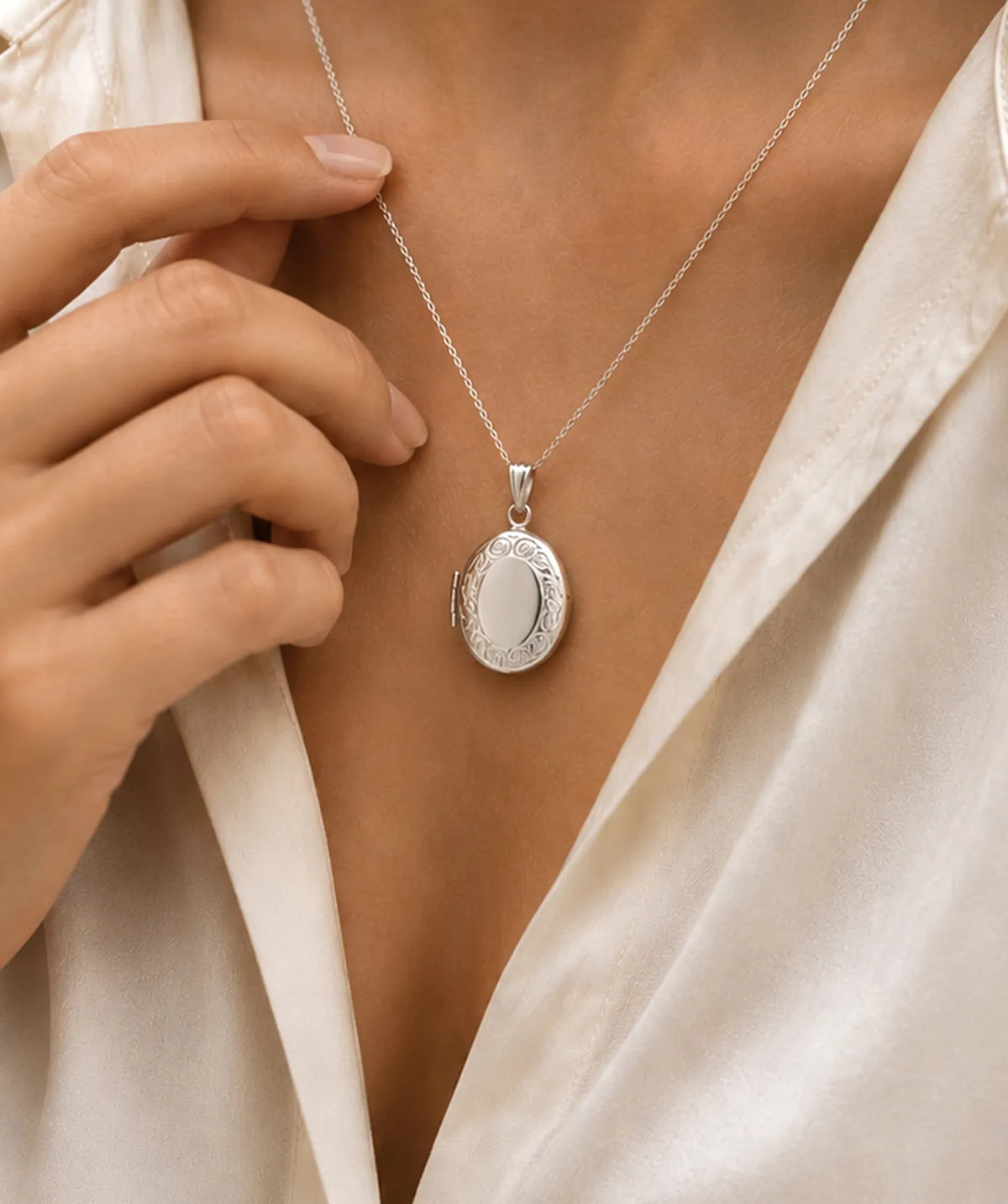 Model wearing the Silver Oval Photo Locket Necklace around the neck