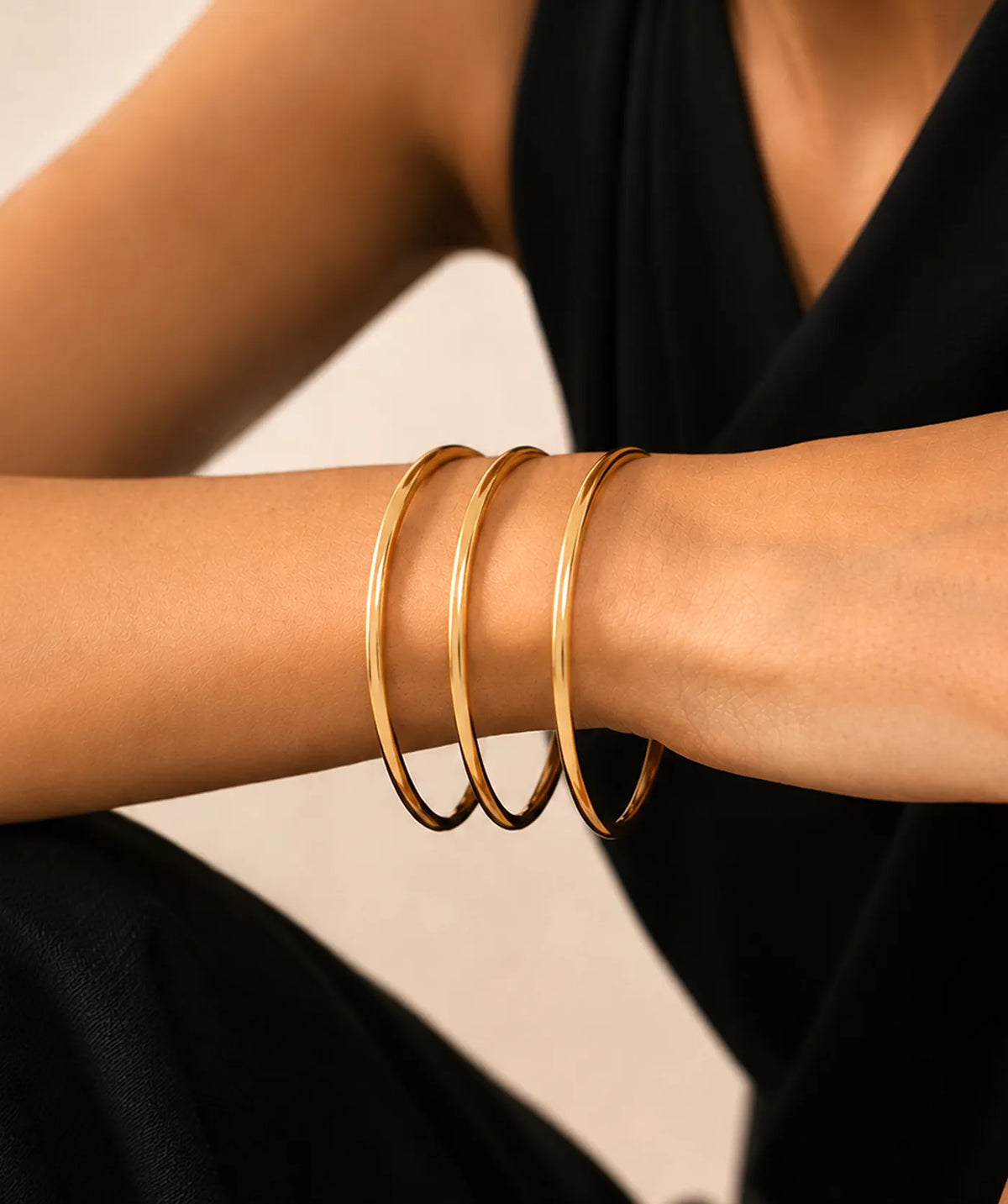 Model wearing the Gold Thin Plain Bangle on the wrist