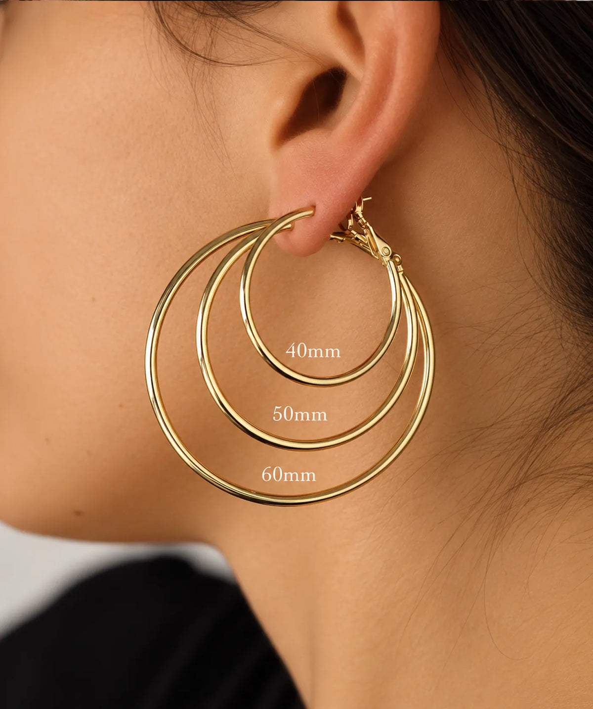 Model wearing the Gold Endless Large Hoop Earrings on the ear