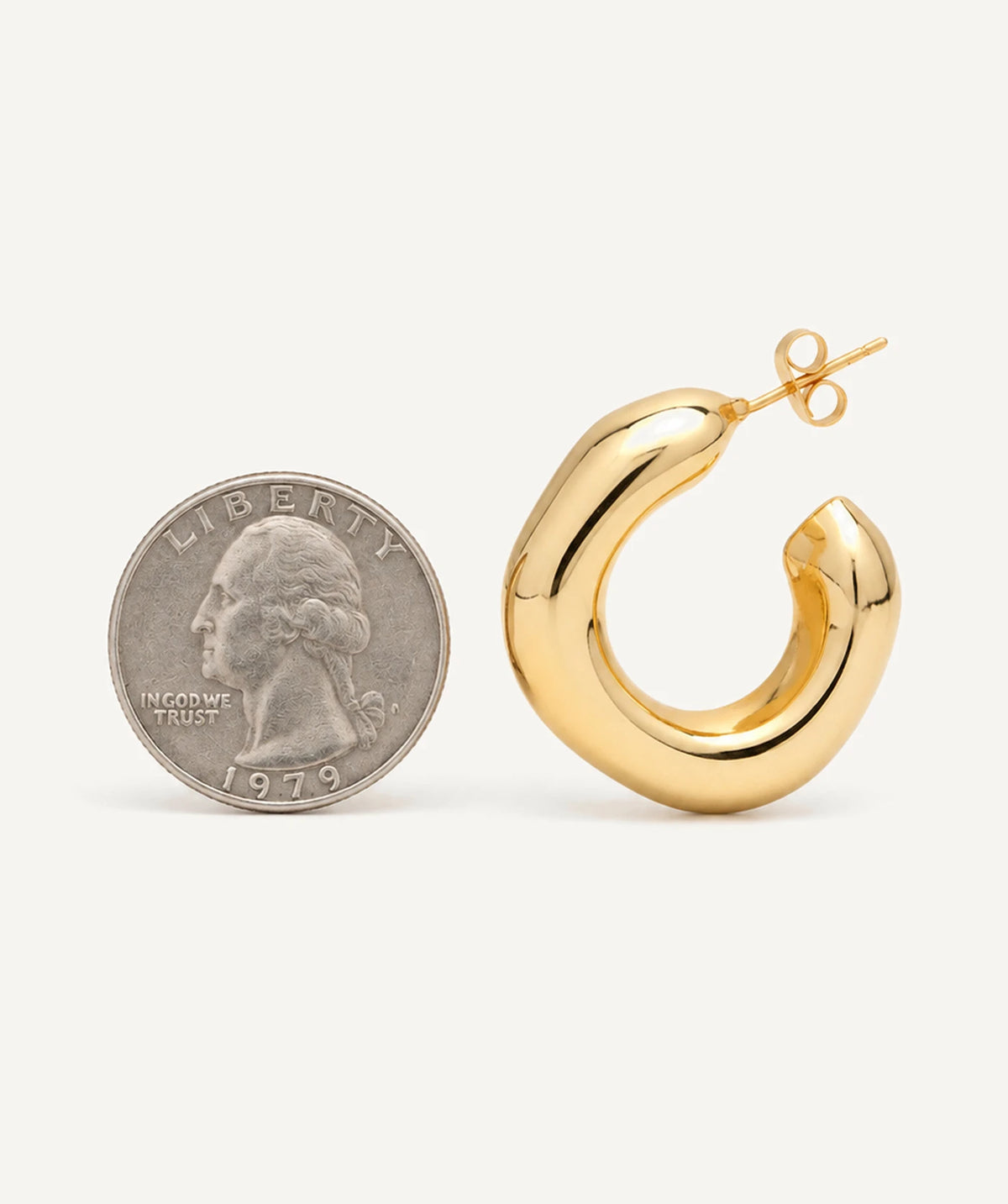 Gold Irregular Open Hoop Earrings next to a coin for size reference