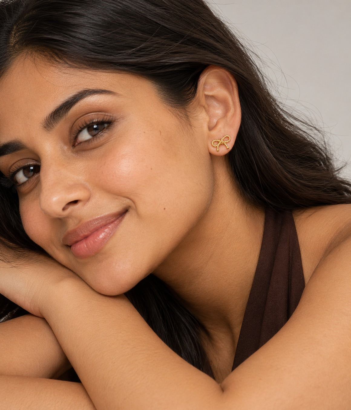 Bow Stud Earrings on model
