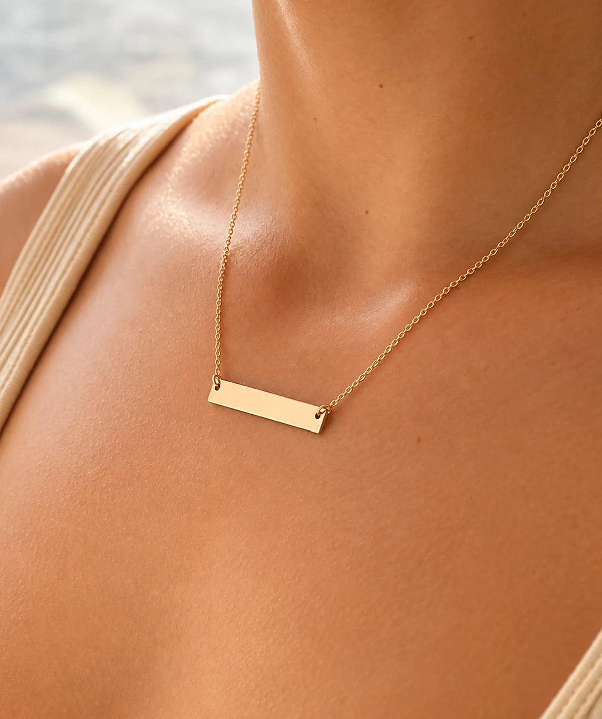 Model wearing the Gold Horizontal Tag Necklace around the neck