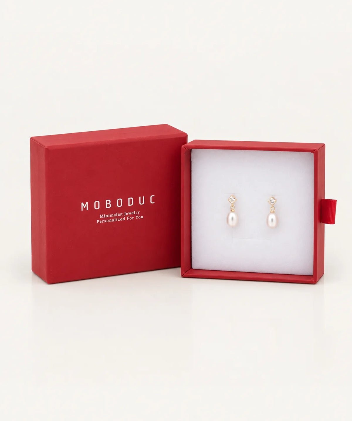 Gold Pearl Drop Stud Earrings in a Moboduc gift box