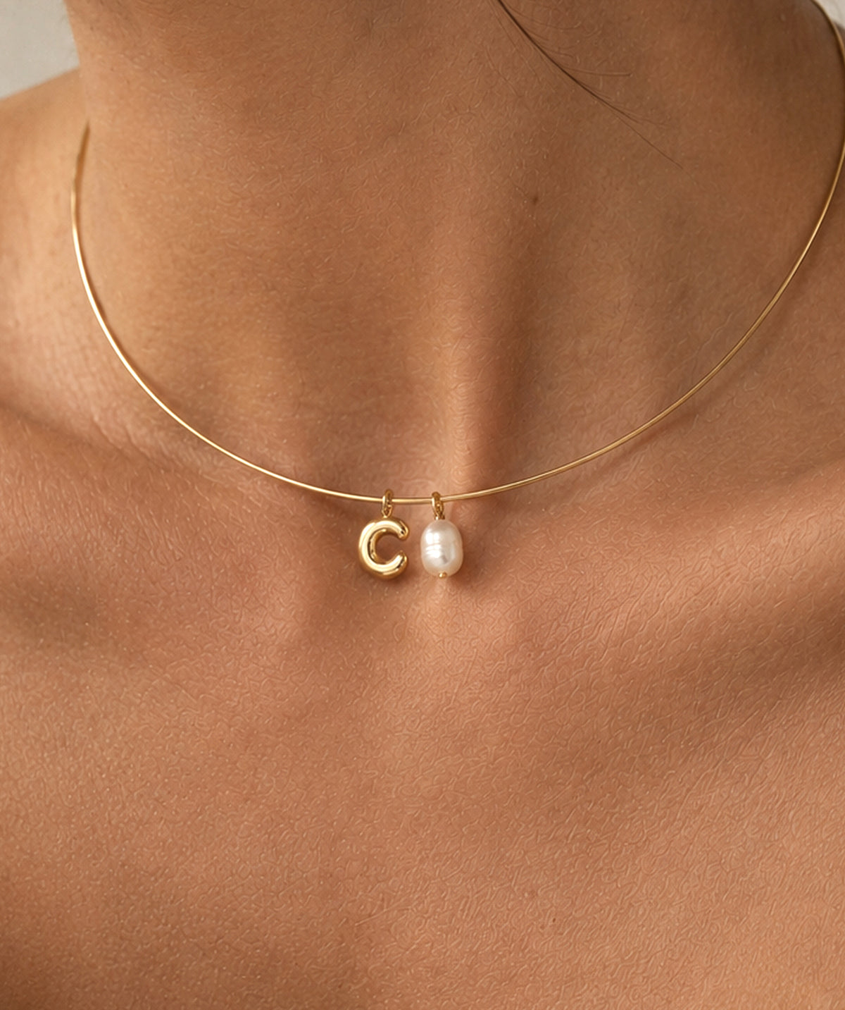 Model wearing the Charm Necklace Built Wire Pendant around the neck