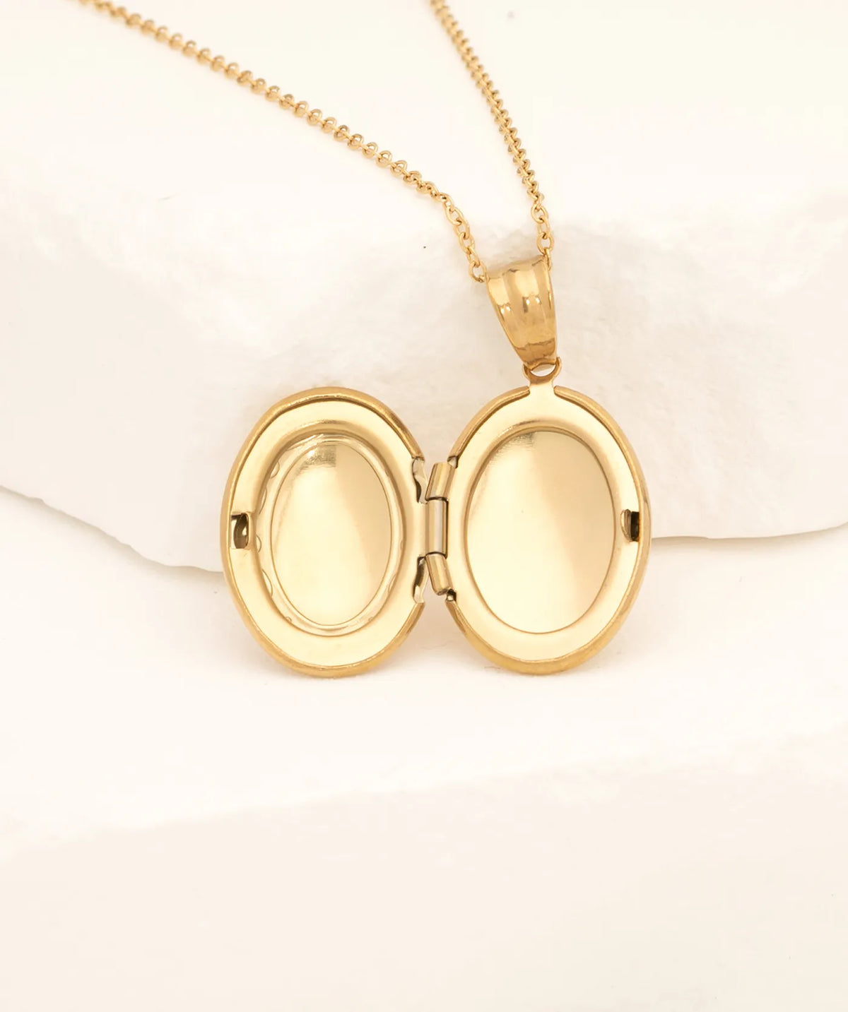 Gold Oval Photo Locket Necklace, opened to show the inside