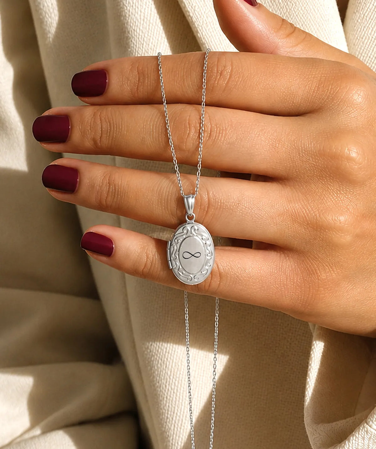 Model wearing the Silver Oval Photo Locket Necklace around the neck