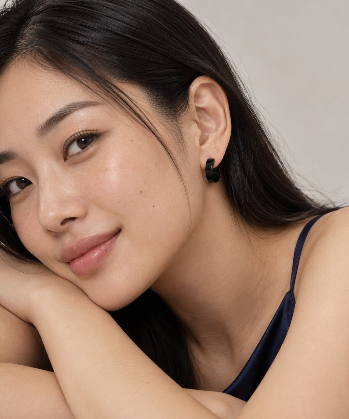 Black Thick Round Flat Hoop Earrings on model