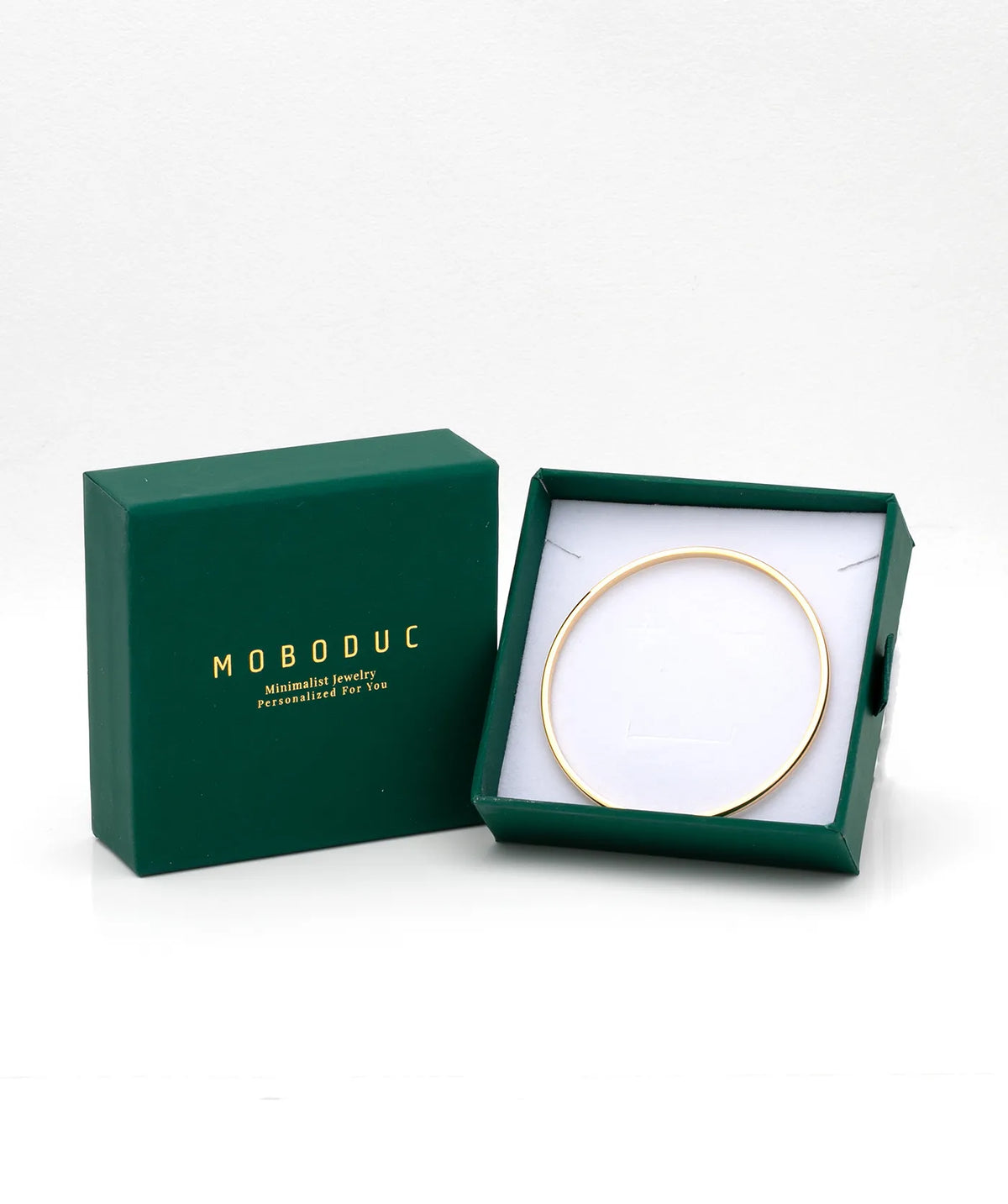 Gold Thin Plain Bangle in a Moboduc gift box