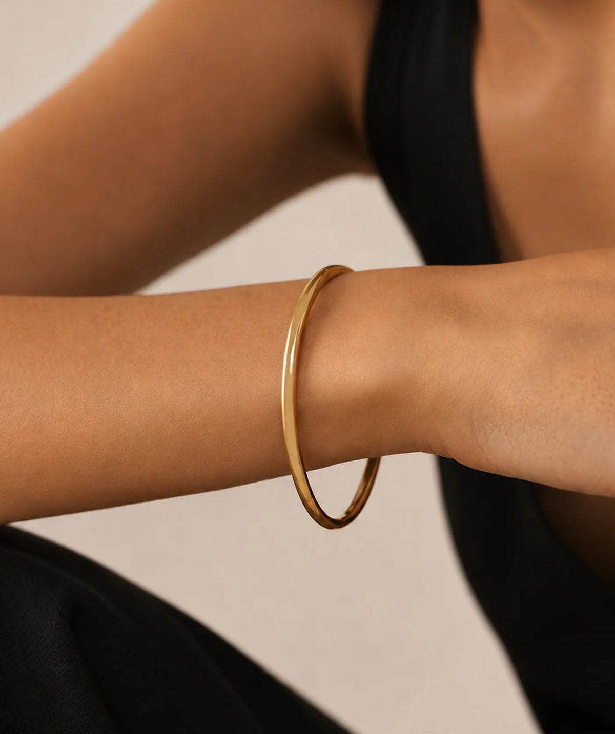 Model wearing the Gold Thin Plain Bangle on the wrist